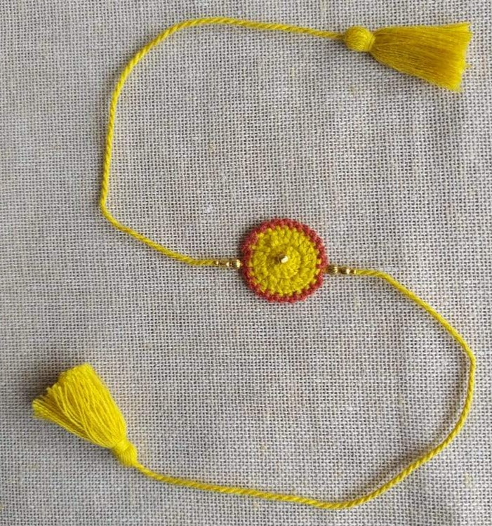 Handmade Crochet Rakhi - Yellow Dandelion