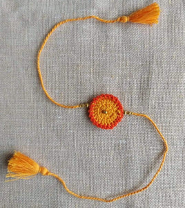 Handmade Crochet Rakhi - Orange Dandelion
