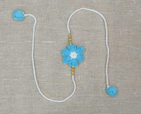 Handmade Crochet Rakhi with Beads - Blue & White Flower
