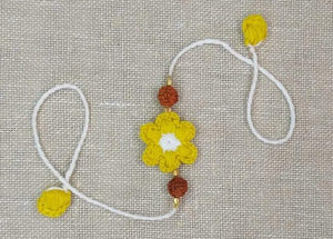 Handmade Crochet Rakhi with Rudraksh - Yellow & White Flower