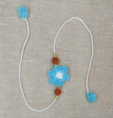 Handmade Crochet Rakhi with Rudraksh - Blue & White Flower
