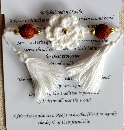 Handmade Crochet Rakhi with Rudrakash - White Double Flower